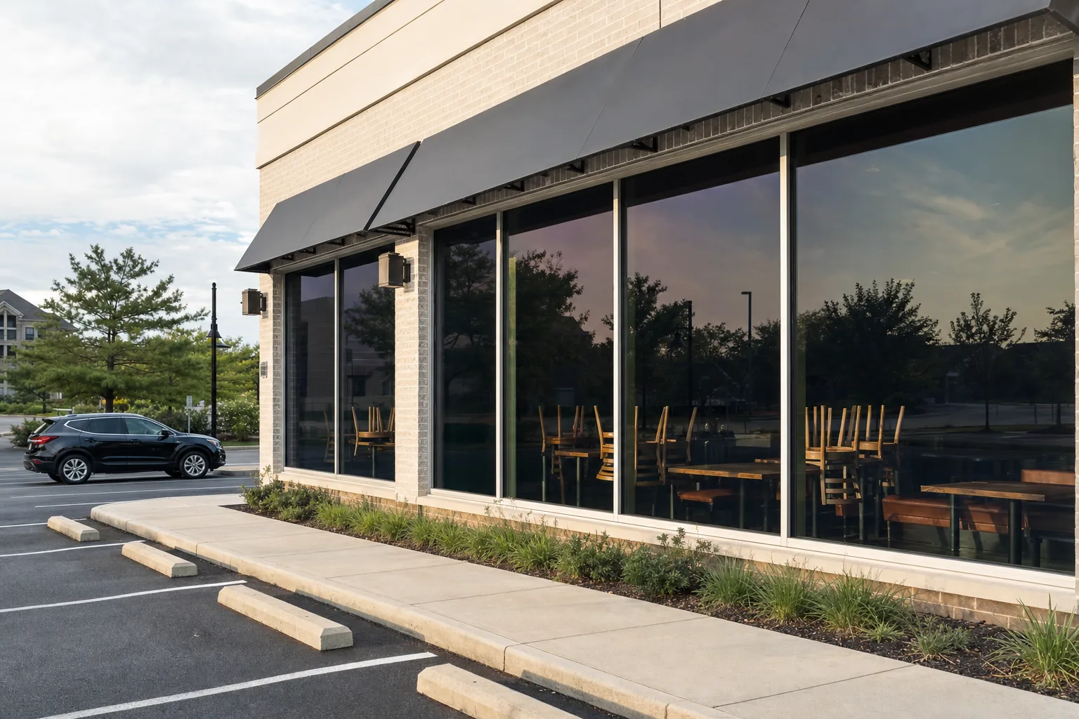 A restaurant's front windows with solar film cutting the glare on the tables
