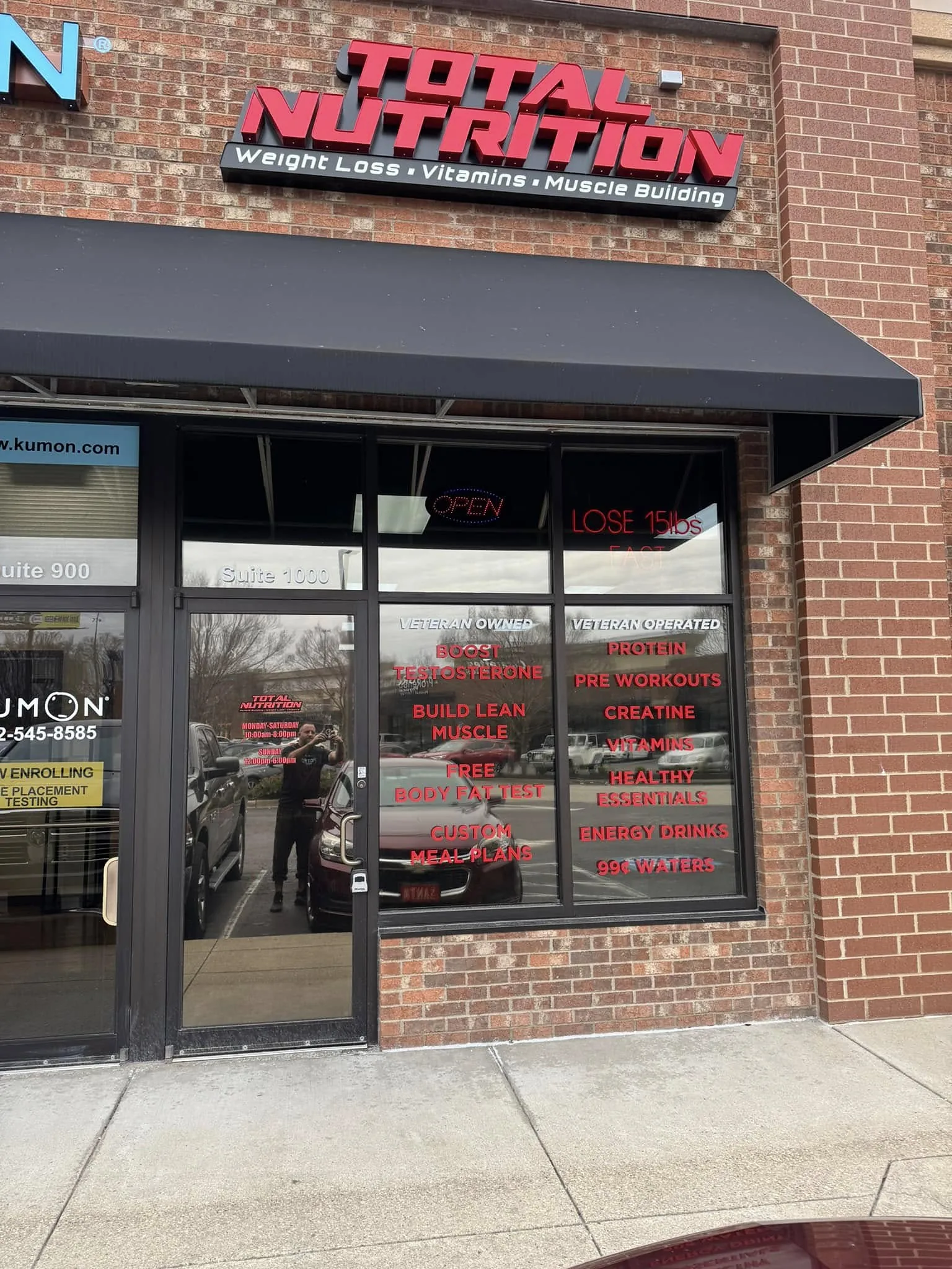 A storefront's windows and door with film, a Totally Tinted job