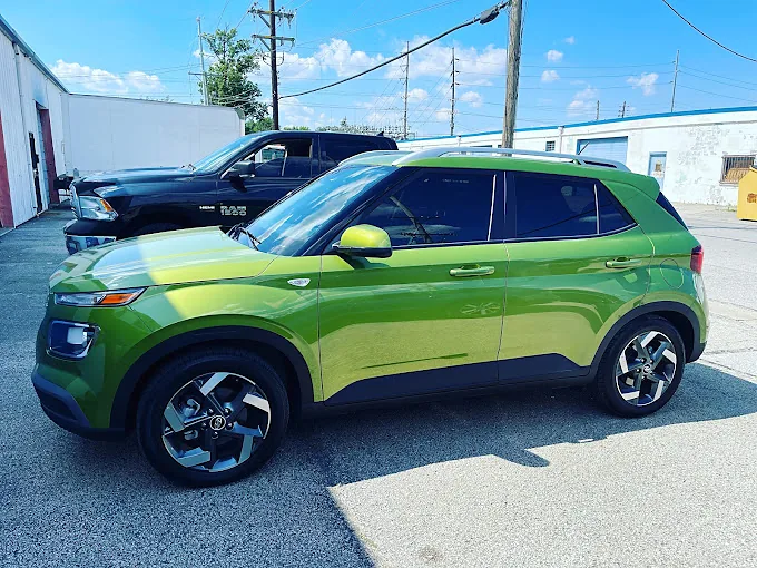 A green Hyundai Venue with tinted windows, a Totally Tinted job